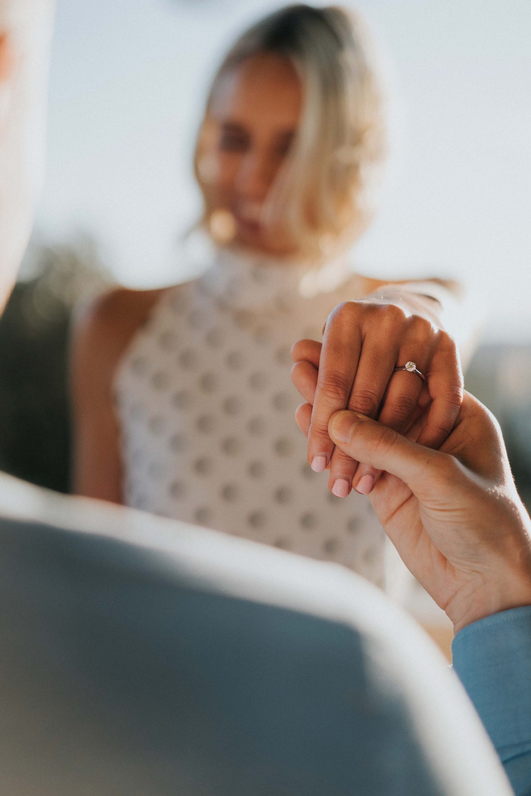 engagement ring photo with bride out of focus