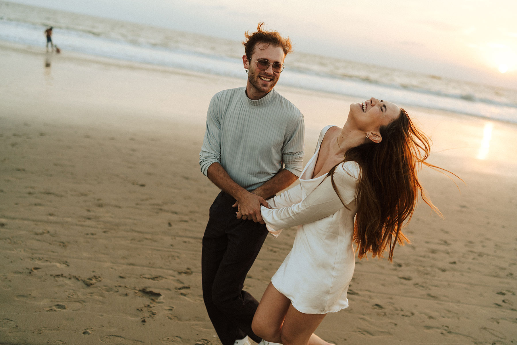 couple laughing in the beach